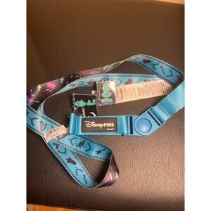 Disney Parks Haunted Mansion lanyard with two bust Disney pins